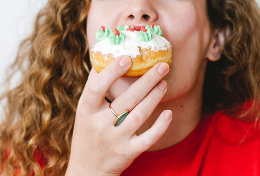 Woman biting a doughnut